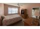 Comfortable bedroom with wooden furniture and bright, natural light at 901-9 West Port Dr. # 907, North Myrtle Beach, SC 29582