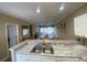 Open floor plan showcasing kitchen with marble countertop and dining and living areas at 901-9 West Port Dr. # 907, North Myrtle Beach, SC 29582