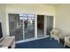 Patio with wicker furniture and views of the scenic pond through sliding glass doors at 901-9 West Port Dr. # 907, North Myrtle Beach, SC 29582