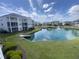 Exterior view of the building overlooking the picturesque pond and well-maintained landscaping at 901-9 West Port Dr. # 907, North Myrtle Beach, SC 29582