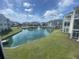 Overlooking a pond featuring a fountain and surrounded by green space and condominium buildings at 901-9 West Port Dr. # 907, North Myrtle Beach, SC 29582