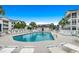 Large community pool surrounded by ample lounge seating, set in a well-maintained area, is perfect for residents at 901-9 West Port Dr. # 907, North Myrtle Beach, SC 29582
