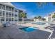 Well-kept pool area featuring both hot tubs and a larger pool with lounge chairs at 901-9 West Port Dr. # 907, North Myrtle Beach, SC 29582
