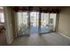 A sunroom features cozy seating with views of a scenic pond at 901-9 West Port Dr. # 907, North Myrtle Beach, SC 29582
