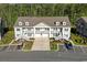 Stunning aerial view of townhouses with well-manicured lawns and ample parking spaces at 932 Jackline Place # 103, Murrells Inlet, SC 29576