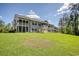 Spacious backyard featuring a screened porch perfect for outdoor gatherings and relaxation at 932 Jackline Place # 103, Murrells Inlet, SC 29576
