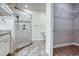 Modern bathroom features a glass shower with tile surround and built-in shelves and a walk-in closet with wire shelves at 932 Jackline Place # 103, Murrells Inlet, SC 29576