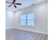 Cozy bedroom featuring stylish ceiling fan and large window for natural light at 932 Jackline Place # 103, Murrells Inlet, SC 29576