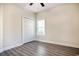 A bright bedroom with wood-look floors, a window, and closet at 932 Jackline Place # 103, Murrells Inlet, SC 29576