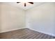 Bedroom features wood-look floors, a ceiling fan, and a door to another room at 932 Jackline Place # 103, Murrells Inlet, SC 29576