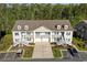 Charming townhouse featuring a double garage, balcony, and well-manicured landscaping at 932 Jackline Place # 103, Murrells Inlet, SC 29576