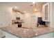Kitchen featuring granite countertops, stainless appliances, white cabinetry, and modern pendant lighting at 932 Jackline Place # 103, Murrells Inlet, SC 29576