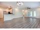 Inviting living area with wood floors, modern lighting, and a smooth flow into the kitchen at 932 Jackline Place # 103, Murrells Inlet, SC 29576