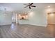 Open-concept living area featuring wood floors, modern lighting, and easy access to the kitchen at 932 Jackline Place # 103, Murrells Inlet, SC 29576