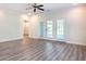 Bright living room features hardwood floors, ceiling fan and french doors leading to the outside at 932 Jackline Place # 103, Murrells Inlet, SC 29576