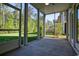 Relax on this screened-in patio, which features a beautiful green view of the yard at 932 Jackline Place # 103, Murrells Inlet, SC 29576