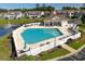 Inviting pool area with lounge chairs and umbrellas, perfect for community enjoyment at 932 Jackline Place # 103, Murrells Inlet, SC 29576