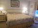 Cozy bedroom with beach themed art, furnishings and decor at 1000 Ray Costin Way # 108, Murrells Inlet, SC 29576