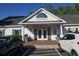 Inviting community clubhouse featuring covered entrance, promoting social and recreational opportunities at 1000 Ray Costin Way # 108, Murrells Inlet, SC 29576