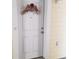 Charming front door with floral wreath and house number, complemented by siding and hardware at 1000 Ray Costin Way # 108, Murrells Inlet, SC 29576