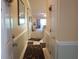 Inviting hallway leading to the living area, featuring decorative rugs and a bright, open layout at 1000 Ray Costin Way # 108, Murrells Inlet, SC 29576