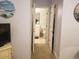Hallway view into a bathroom and closet at 1000 Ray Costin Way # 108, Murrells Inlet, SC 29576
