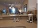 Open kitchen counter area with modern appliances, décor, and a partial view of the dining and living spaces at 1000 Ray Costin Way # 108, Murrells Inlet, SC 29576