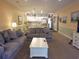Bright living room leading into the kitchen with two gray couches and a white center table at 1000 Ray Costin Way # 108, Murrells Inlet, SC 29576