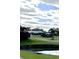 Elegant clubhouse exterior surrounded by manicured lawns and lush landscaping, ideal for community gatherings at 103 Club Circle # 1-1, Pawleys Island, SC 29585