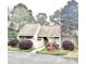 Charming single-story home featuring a well-manicured lawn and inviting front entrance at 103 Club Circle # 1-1, Pawleys Island, SC 29585