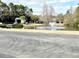 Scenic view of the pond with a fountain and lush landscaping enhancing the community appeal at 103 Club Circle # 1-1, Pawleys Island, SC 29585
