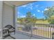 Balcony with furniture overlooking green space, mature trees, and parked truck at 1033 World Tour Blvd. # 203, Myrtle Beach, SC 29579