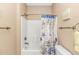 Bathroom featuring a shower and tub combo, with a themed shower curtain and wall decor at 1033 World Tour Blvd. # 203, Myrtle Beach, SC 29579