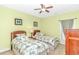 Cozy bedroom with twin beds, ceiling fan, and soft lighting, creating a peaceful and comfortable retreat at 1033 World Tour Blvd. # 203, Myrtle Beach, SC 29579