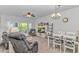 Open-concept living room featuring a sliding glass door and connected to the dining area at 1033 World Tour Blvd. # 203, Myrtle Beach, SC 29579