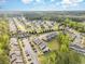 Aerial view of a residential community with townhomes, lush greenery, and roadways at 1105 Dinger Ct. # 1105, Myrtle Beach, SC 29588
