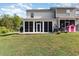 Home featuring a screened-in porch and a spacious backyard at 1105 Dinger Ct. # 1105, Myrtle Beach, SC 29588