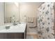 Bathroom featuring dark wooden vanity and seashell patterned shower curtain at 1105 Dinger Ct. # 1105, Myrtle Beach, SC 29588