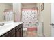 Cozy bathroom featuring a dark wood vanity, decorative shower curtain, and neutral tones at 1105 Dinger Ct. # 1105, Myrtle Beach, SC 29588