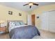 Bedroom featuring a bed, nightstand and closet with light yellow paint at 1105 Dinger Ct. # 1105, Myrtle Beach, SC 29588