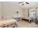Bright bedroom featuring two beds, desk and ceiling fan at 1105 Dinger Ct. # 1105, Myrtle Beach, SC 29588