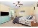Bedroom with bed, TV, ceiling fan, light turquoise furniture and natural light at 1105 Dinger Ct. # 1105, Myrtle Beach, SC 29588