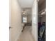 View down hallway into bedroom with ceiling fan and natural light at 1105 Dinger Ct. # 1105, Myrtle Beach, SC 29588