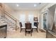 Bright dining area with tile floor, staircase and convenient in-unit laundry at 1105 Dinger Ct. # 1105, Myrtle Beach, SC 29588