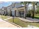 Attractive townhome showcasing professional landscaping, covered porch and convenient accessible parking at 1105 Dinger Ct. # 1105, Myrtle Beach, SC 29588
