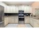 Charming kitchen with stainless appliances, granite counters, and a stylish backsplash at 1105 Dinger Ct. # 1105, Myrtle Beach, SC 29588
