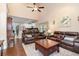 Open-concept living area with hardwood floors, a ceiling fan, and kitchen view at 1105 Dinger Ct. # 1105, Myrtle Beach, SC 29588