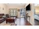 Warm living room showcasing hardwood floors, a window, and entryway view at 1105 Dinger Ct. # 1105, Myrtle Beach, SC 29588