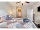Bright bedroom with a view to the bathroom and walk in closet, hardwood floors, and a ceiling fan at 1105 Dinger Ct. # 1105, Myrtle Beach, SC 29588