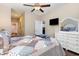 Spacious bedroom with a view to the bathroom and walk in closet, hardwood floors, and a ceiling fan at 1105 Dinger Ct. # 1105, Myrtle Beach, SC 29588